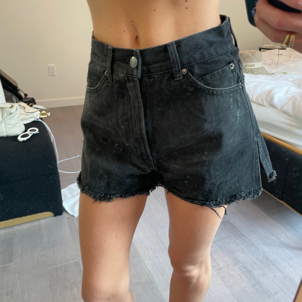 Black jeans shorts with slits in sides.